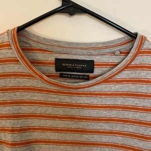 Orange and gray striped tshirt.